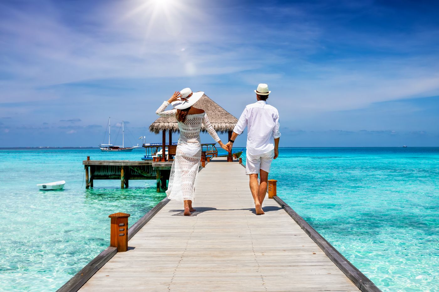 Couple watching sunset on romantic getaway
